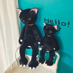 Peluche chat noir mécontent assis