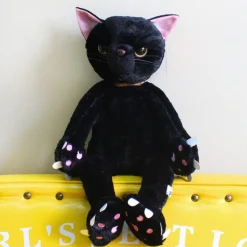 Peluche chat noir mécontent assis