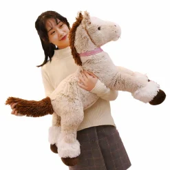 Peluche cheval beige couché