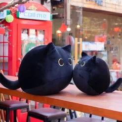 Peluche en forme d’oreiller chat noir