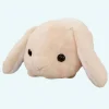 Peluche lapin beige couché