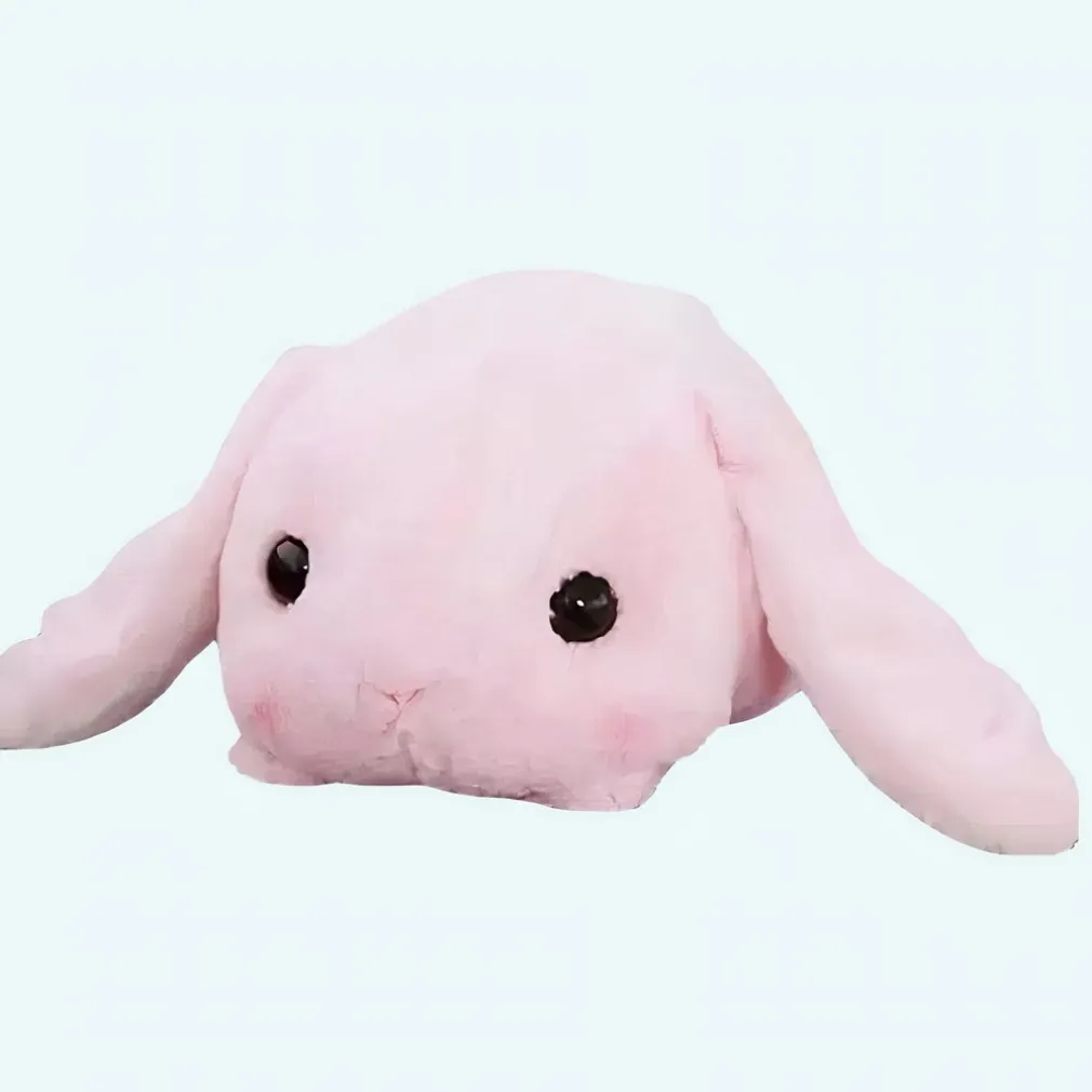 Peluche lapin rose couché