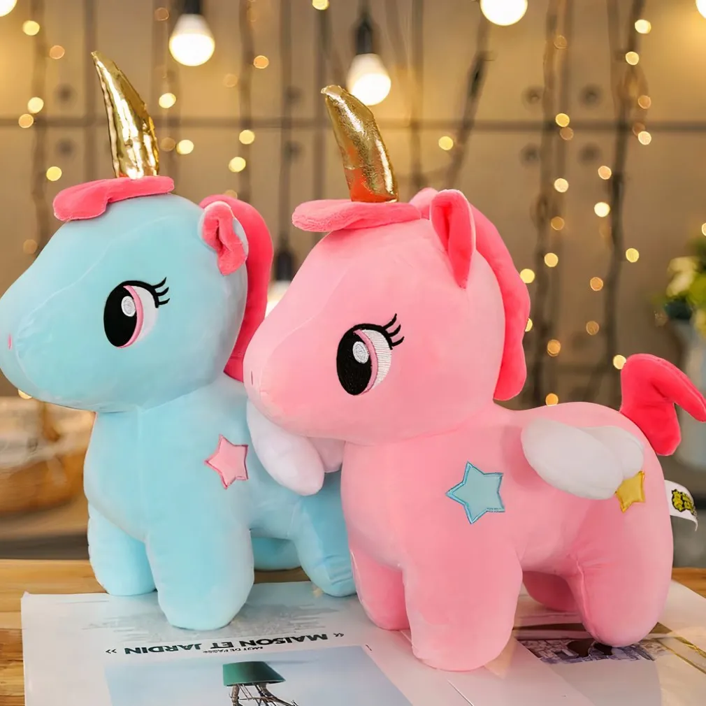 Peluche licorne rose de corne dorée