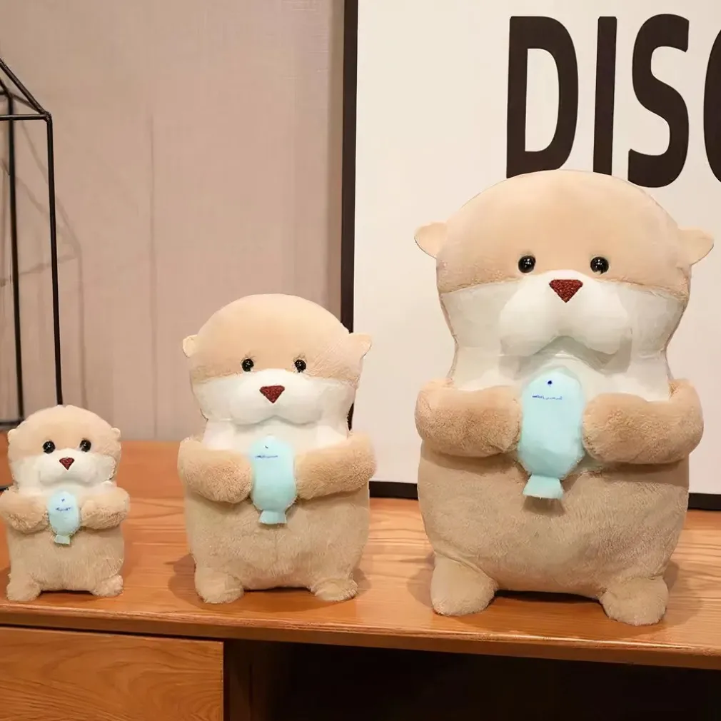 Peluche loutre avec son poisson