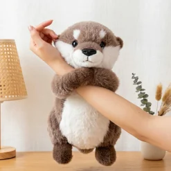 Peluche loutre câline aux pattes aimantées