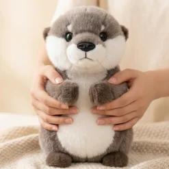 Peluche loutre câline aux pattes aimantées