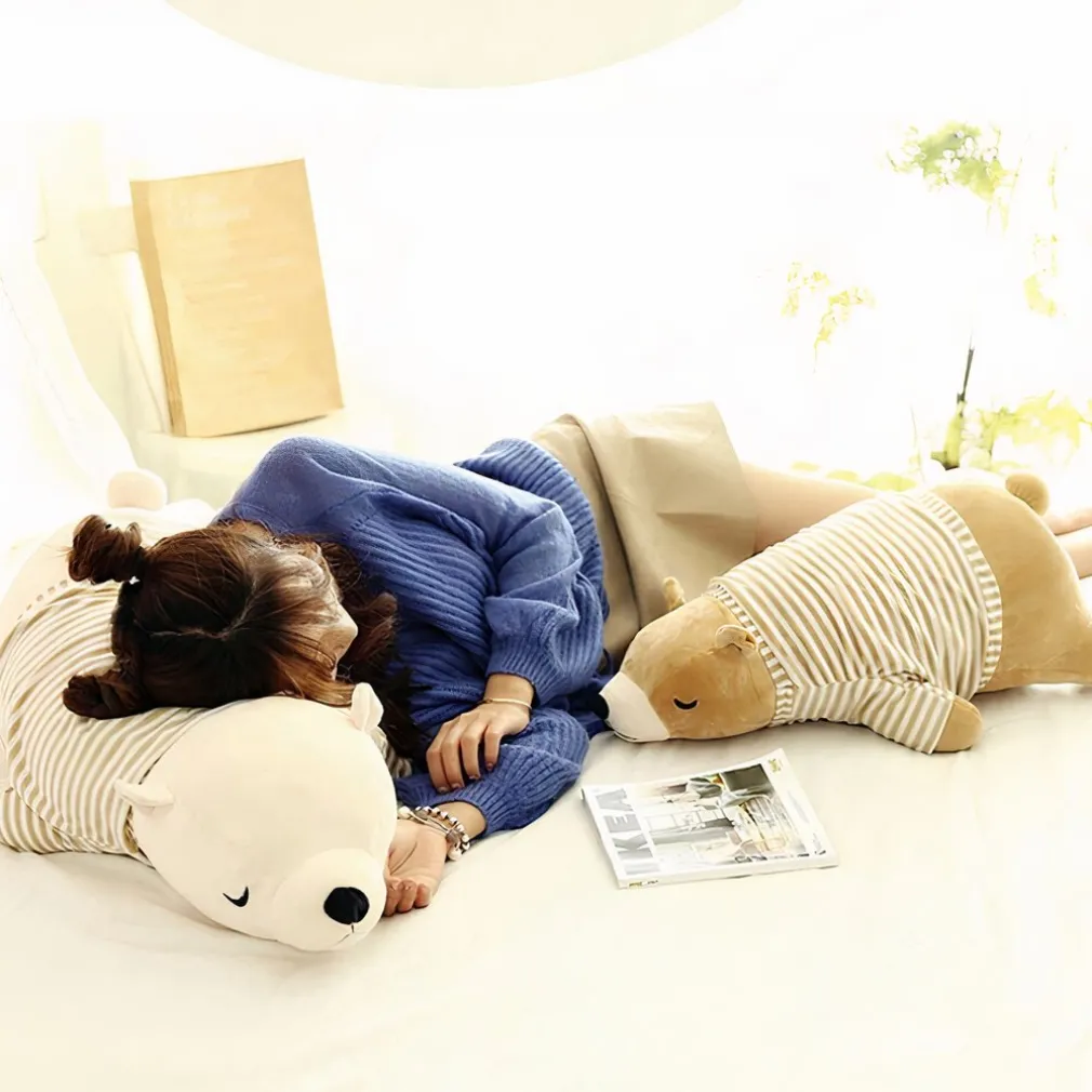 Peluche ours blanc habillé qui dort