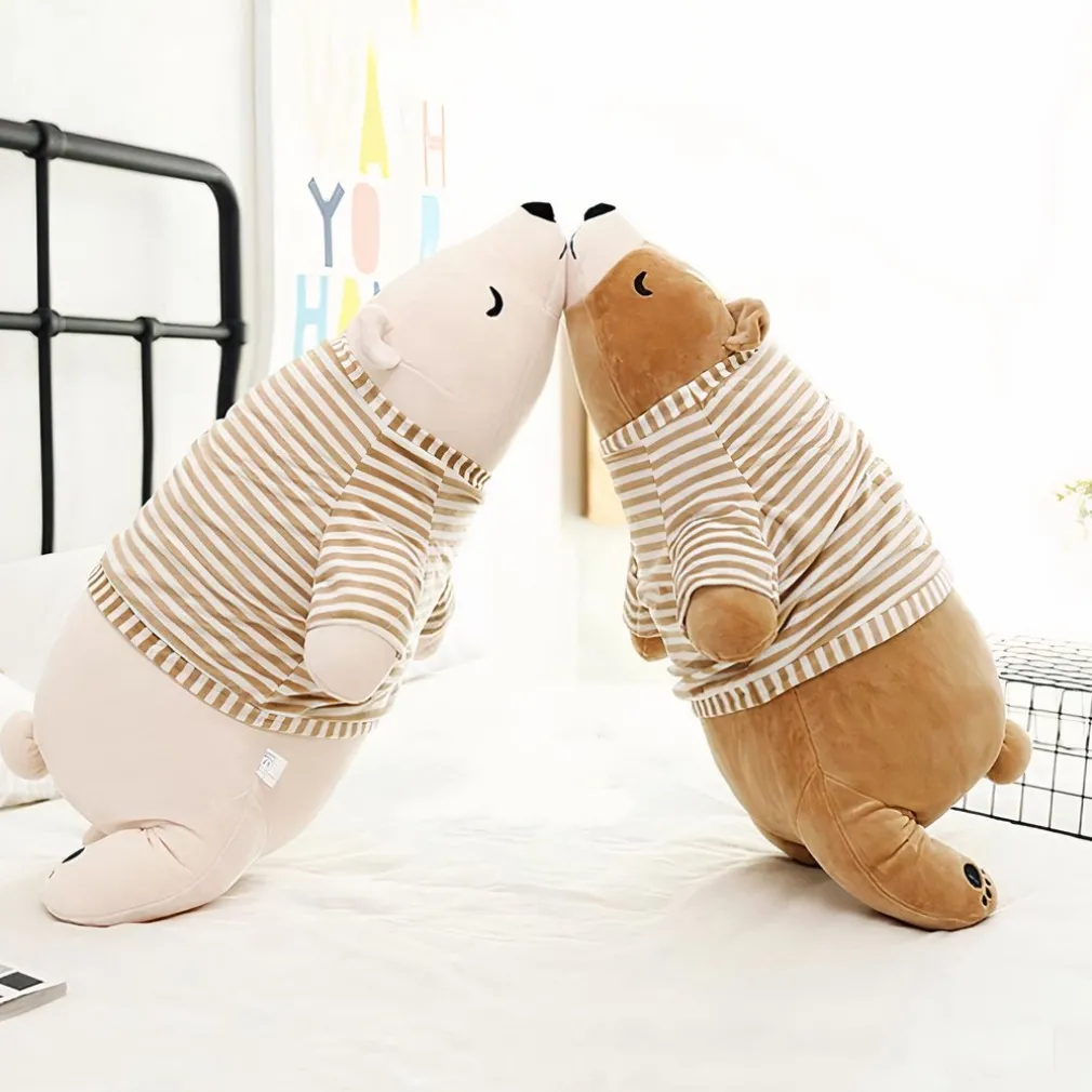 Peluche ours blanc habillé qui dort