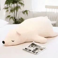 Peluche ours blanc qui dort