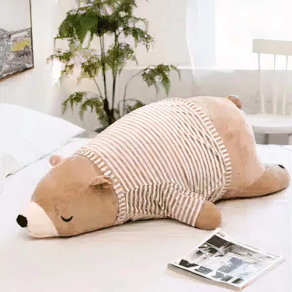 Peluche ours marron habillé qui dort