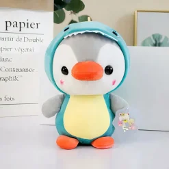 Peluche pingouin déguisé en dinosaure