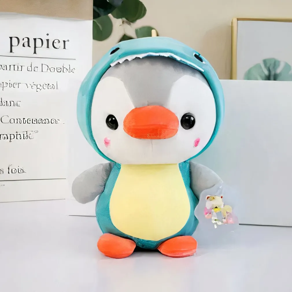 Peluche pingouin déguisé en dinosaure