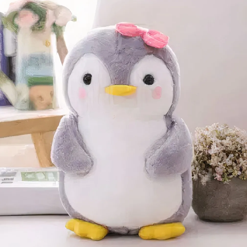 Peluche pingouin nœud rose