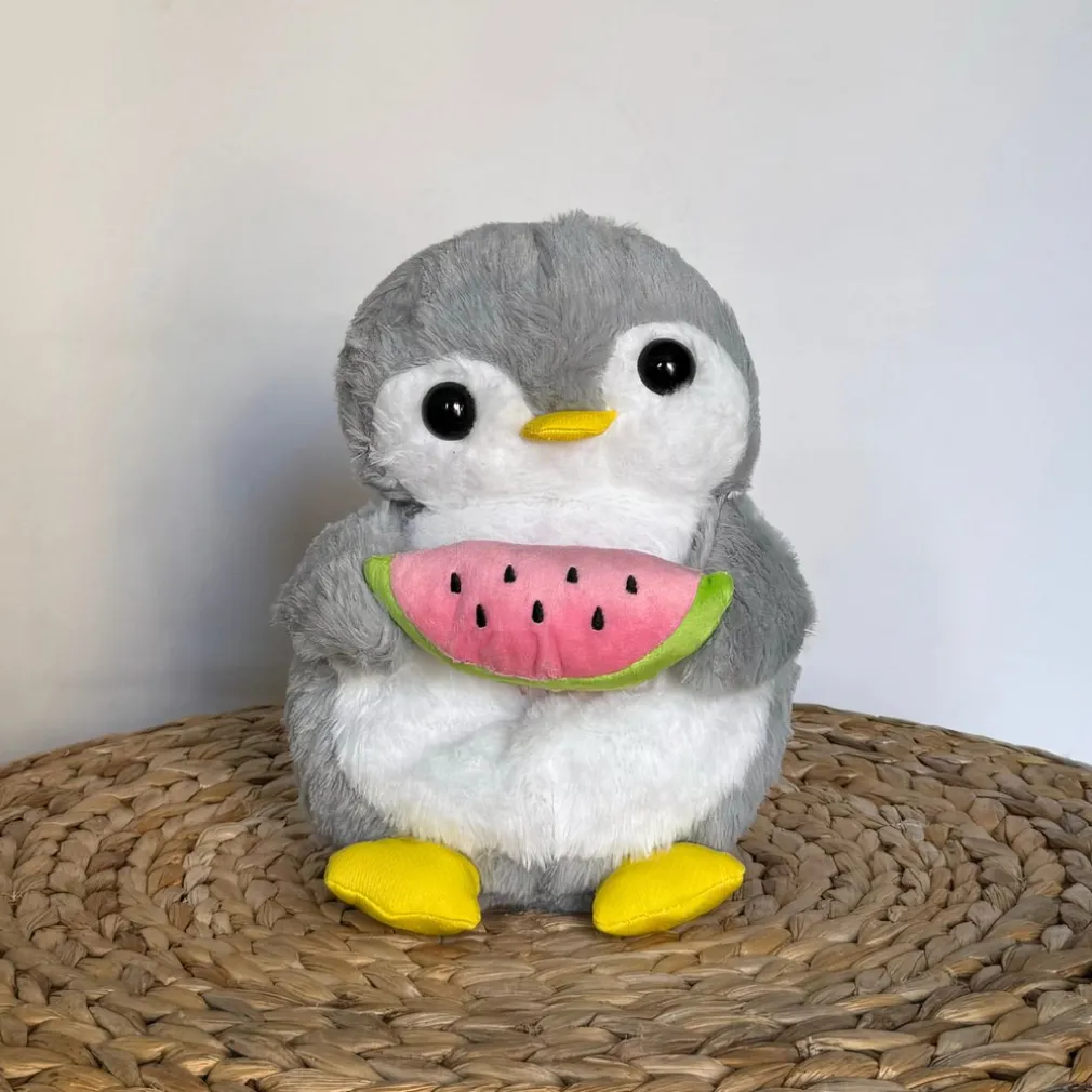 Peluche pingouin qui respire avec berceuses intégrées
