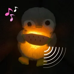 Peluche pingouin qui respire avec berceuses intégrées
