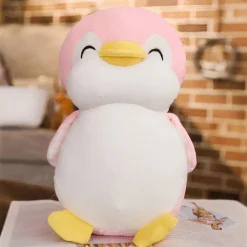 Peluche pingouin rose souriant