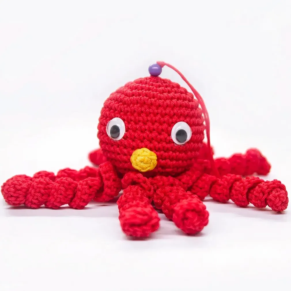 Peluche poulpe rouge douce tressée pour enfant