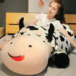 Peluche vache allongée