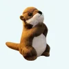 Petite peluche loutre en prière