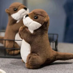 Petite peluche loutre en prière