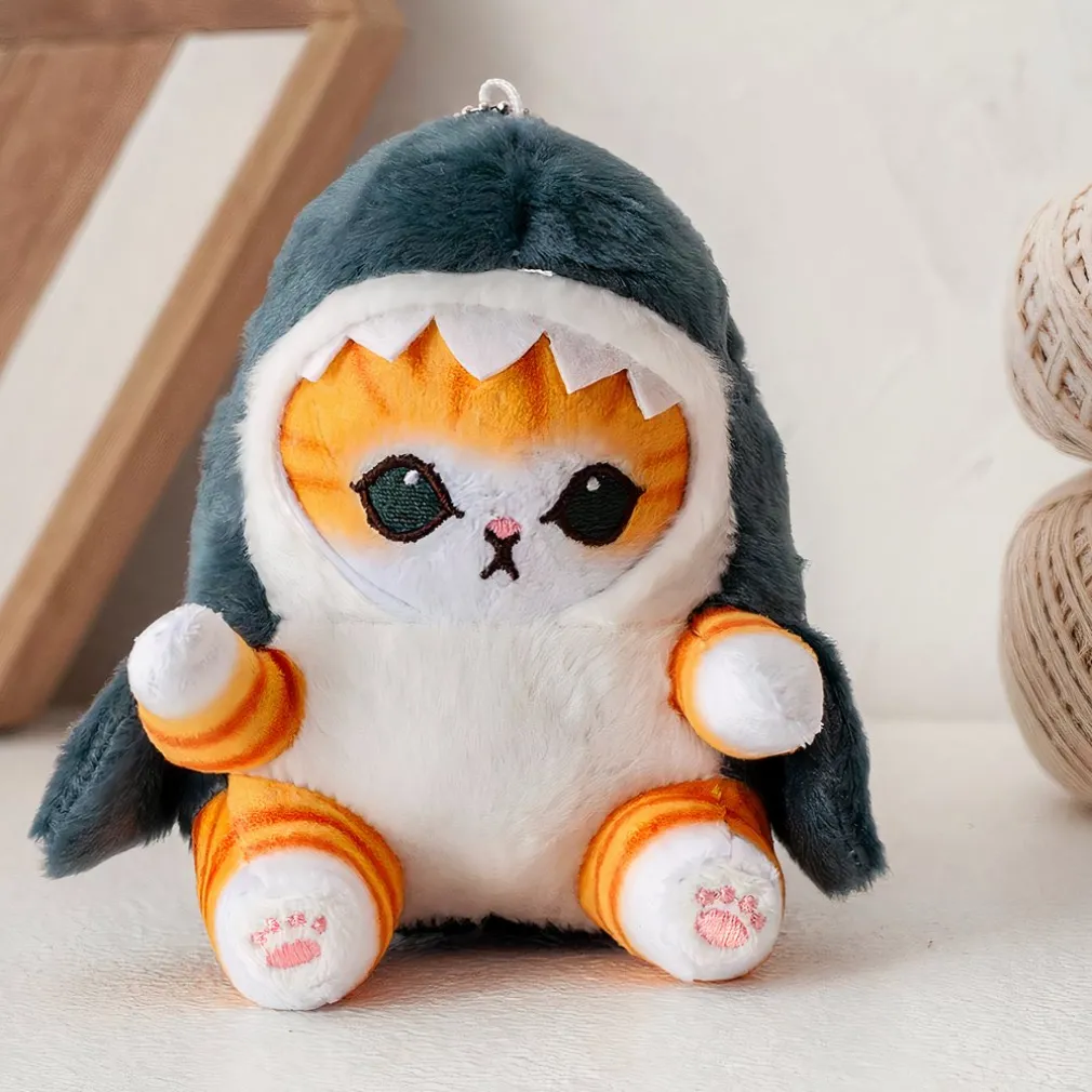 Poupée en peluche petit chat déguisé en requin